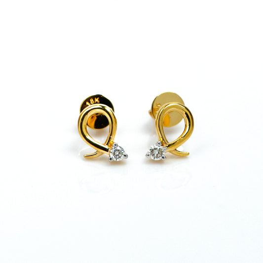 Caratly 18kt gold Loop Diamond Earring with 0.06ct diamond accent in a twisted gold wire loop design, minimal luxury gifts under Rs. 30,000