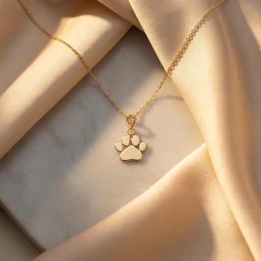 Caratly 18kt gold Paw Gold Pendant featuring a small, polished solid gold paw print charm on a delicate chain under Rs. 15,000