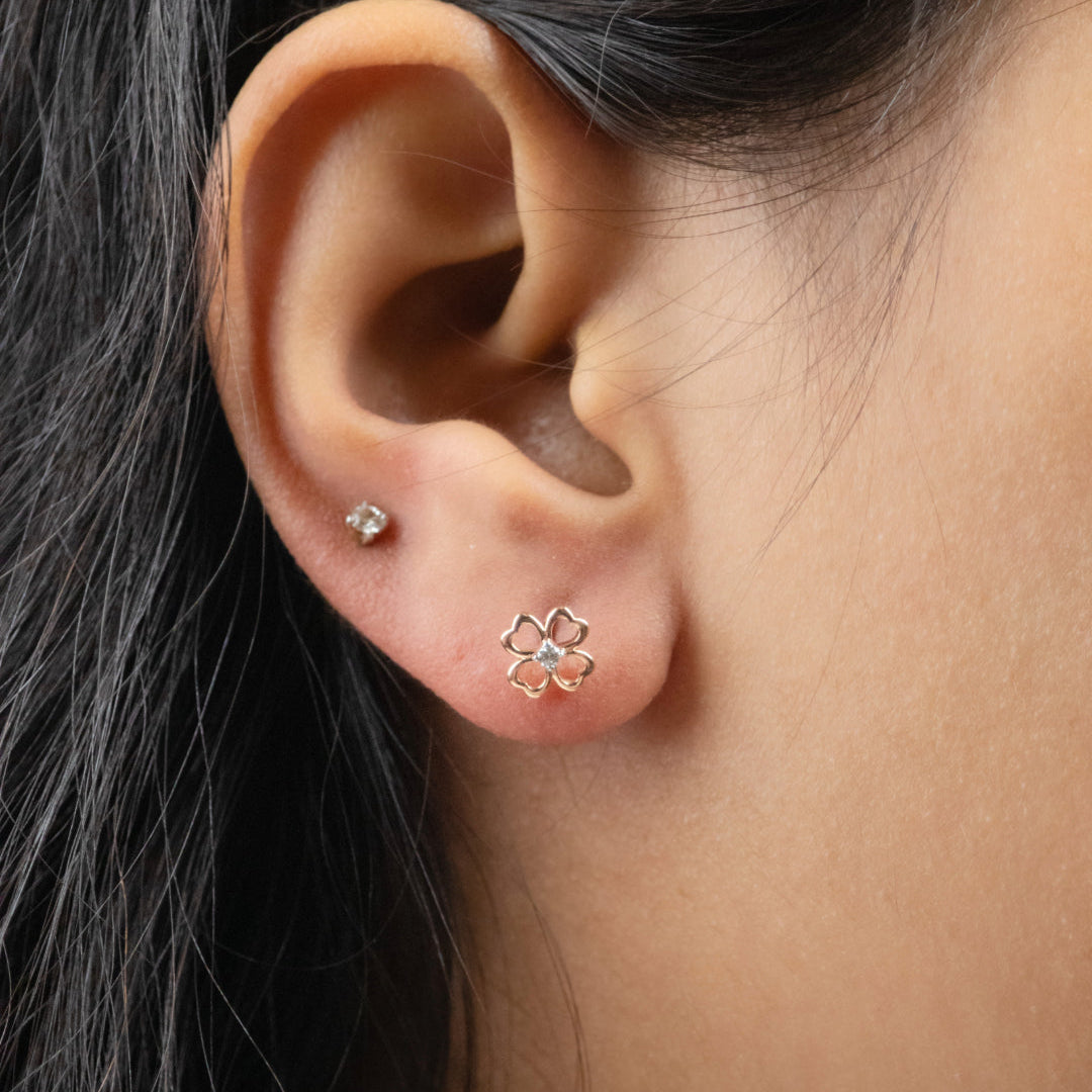 Caratly 18kt gold Petals Diamond Earring with 0.04ct diamond center in an open-work four-petal flower stud design under Rs. 30,000