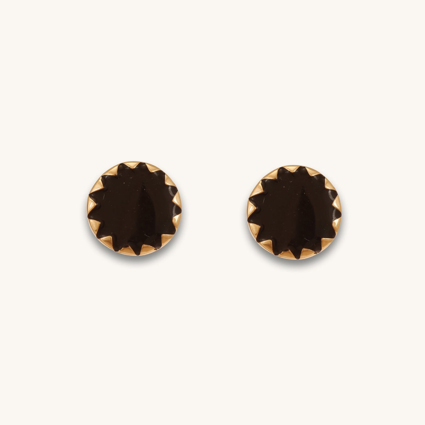 Caratly 18kt gold Round Gold Earring featuring a dark, flat circular center with a jagged, sunburst-style gold bezel setting under rs. 30,000