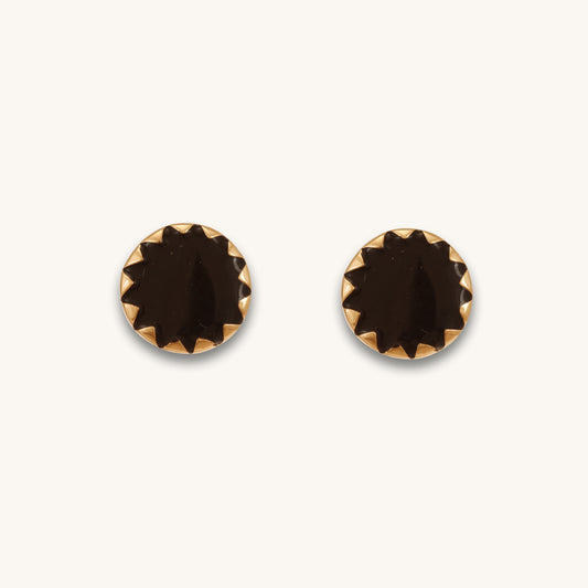 Caratly 18kt gold Round Gold Earring featuring a dark, flat circular center with a jagged, sunburst-style gold bezel setting under rs. 30,000