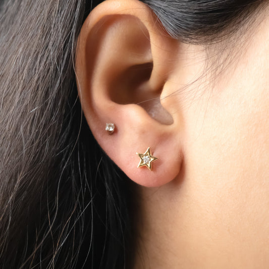 Caratly 18kt gold Star Diamond Earring with 0.02ct diamond center in a five-pointed star stud design. Perfect for gifting it to her under Rs. 20,000