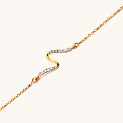Caratly 18kt gold Swirl Diamond Bracelet featuring a smooth, fluid S-curve wave motif partially set with pave diamonds. Everyday minimal designs for her under Rs. 25,000