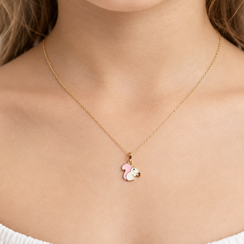 Gold chipmunk pendant with pink and white enamel detailing. Cute gifts under Rs. 20,000