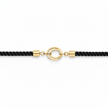 Black rope men's gold bracelet featuring an 18kt gold circle ring charm motif. An affordable gold gift for him under Rs. 15,000