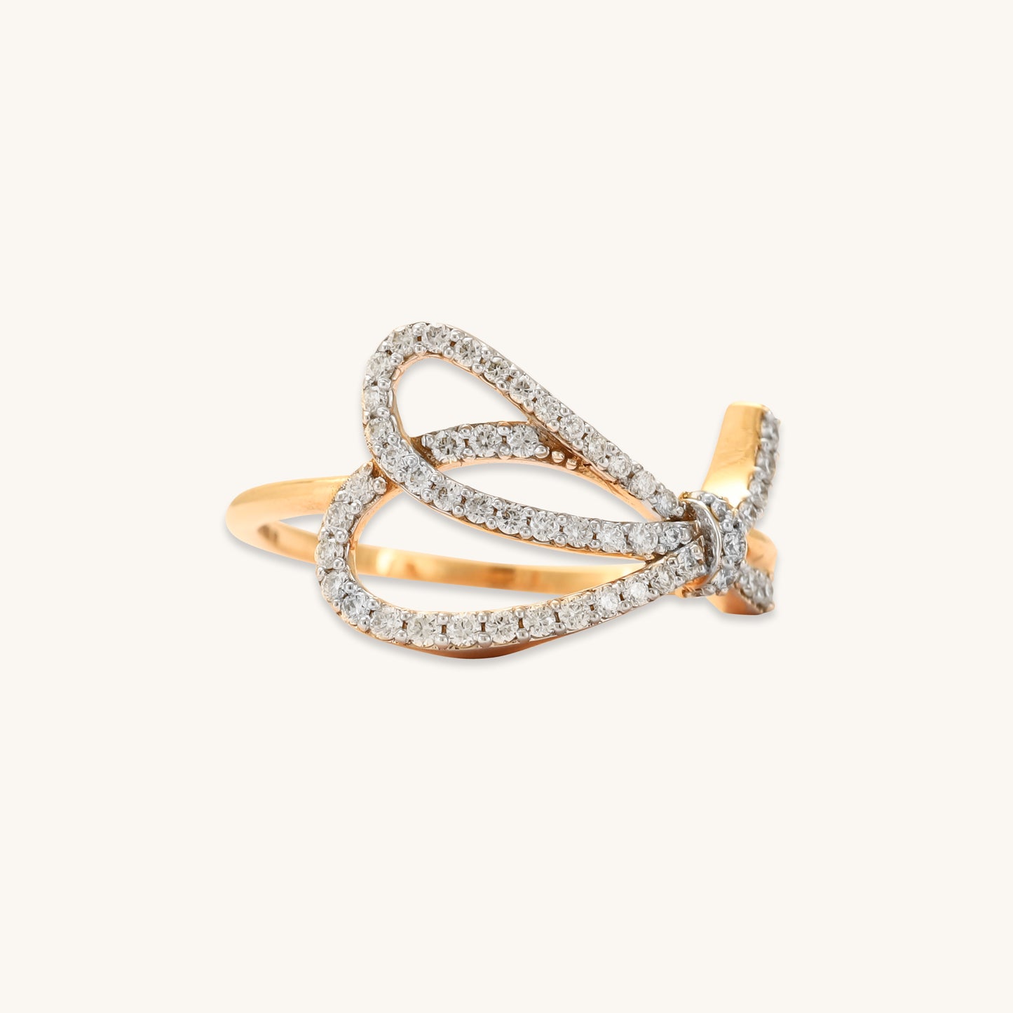 Caratly 18kt gold Bow Diamond Ring featuring an open, asymmetrical ribbon or bow shape fully outlined in pave diamonds