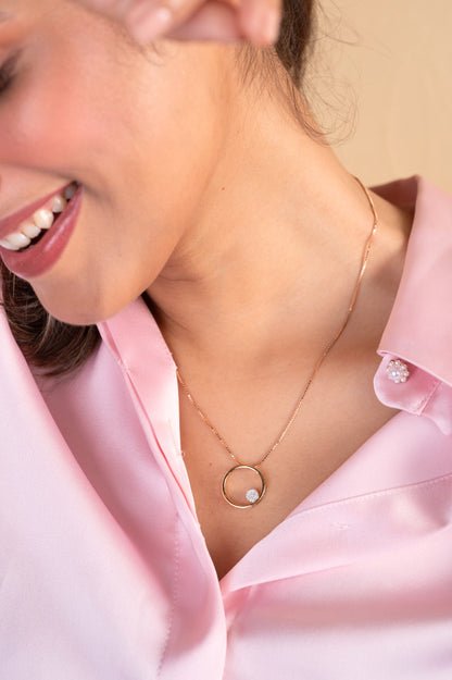 Elevate your everyday style with our exquisite 18kt gold Circle Diamond Pendant. Featuring a sparkling diamond, this timeless design is perfect for everyday wear, effortlessly adding elegance to your casual, work, or formal attire. Ideal as a gift for her under 30,000.