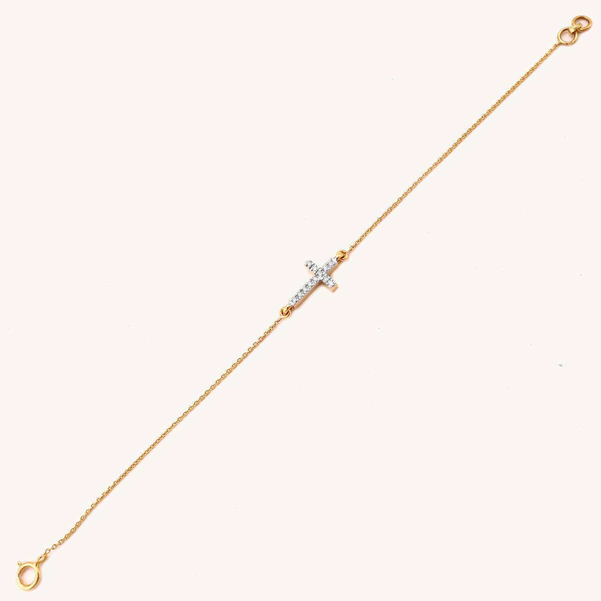 18kt gold Cross Diamond Bracelet featuring a delicate diamond-studded cross pendant centered on a fine gold chain under Rs. 40,000