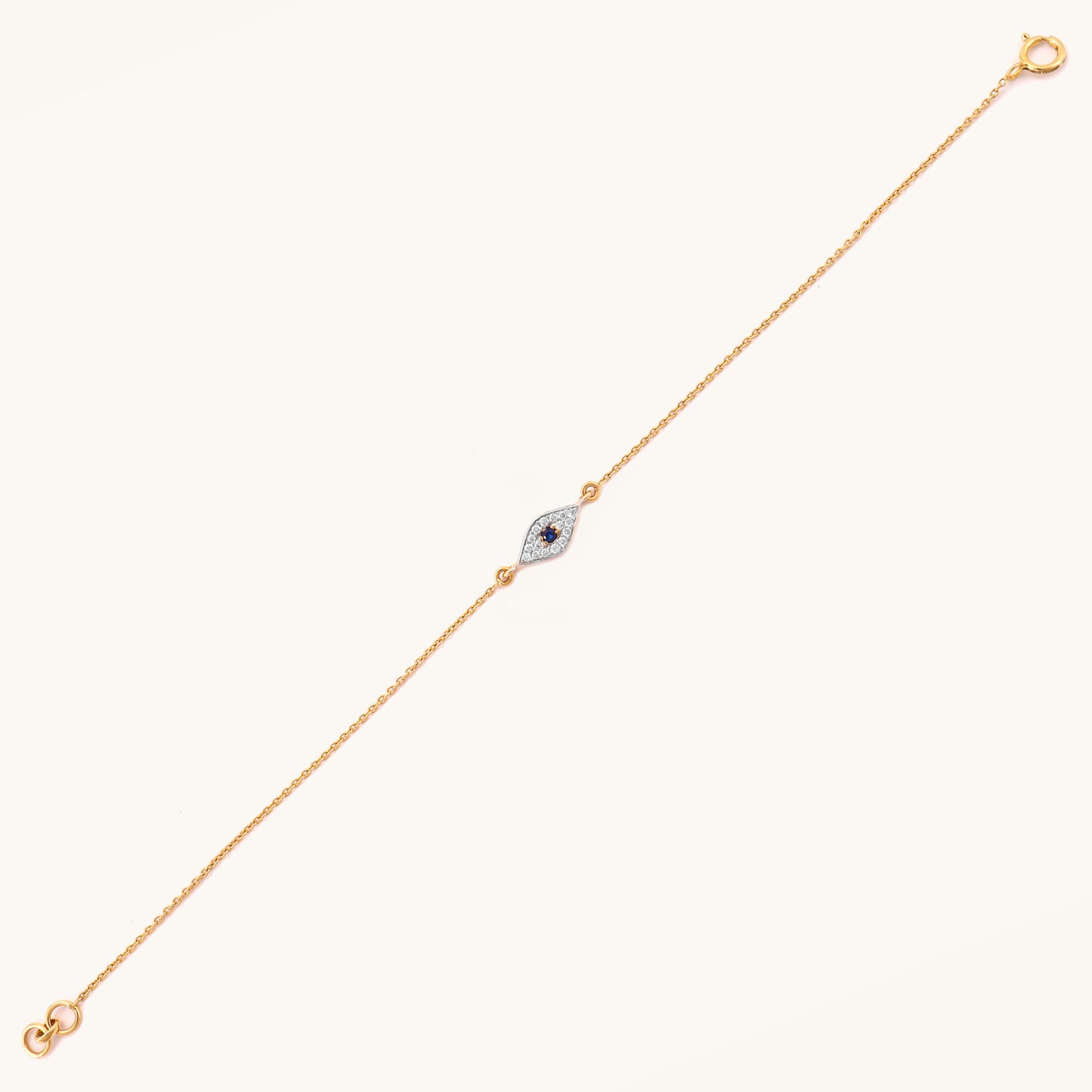 Caratly 18kt gold Evil Eye Bracelet featuring a marquise-shaped charm with a dark blue center stone surrounded by pave diamonds. Evil eye bracelet gift for her under Rs. 25,000