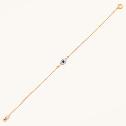 Caratly 18kt gold Evil Eye Bracelet featuring a marquise-shaped charm with a dark blue center stone surrounded by pave diamonds. Evil eye bracelet gift for her under Rs. 25,000