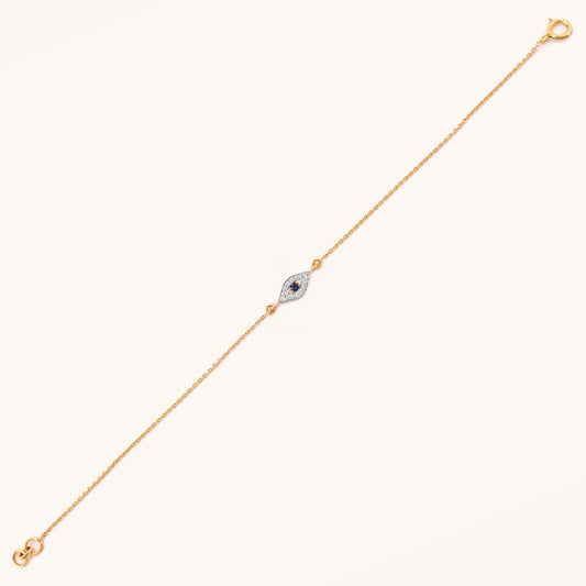 Caratly 18kt gold Evil Eye Bracelet featuring a marquise-shaped charm with a dark blue center stone surrounded by pave diamonds. Evil eye bracelet gift for her under Rs. 25,000