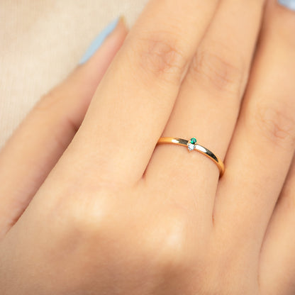 Caratly 18kt gold Emerald Basic Ring with green emerald and 0.01ct diamond accent on a thin minimalist band under Rs. 15,000