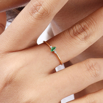 Caratly 18kt gold Green Diamond Ring featuring a very thin band with a central marquise or leaf-shaped green gemstone and two small round side diamonds under Rs. 20,000