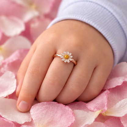 Rose gold ring with a white enamel daisy flower and a yellow center. Cute gifts for kids under Rs. 20,000