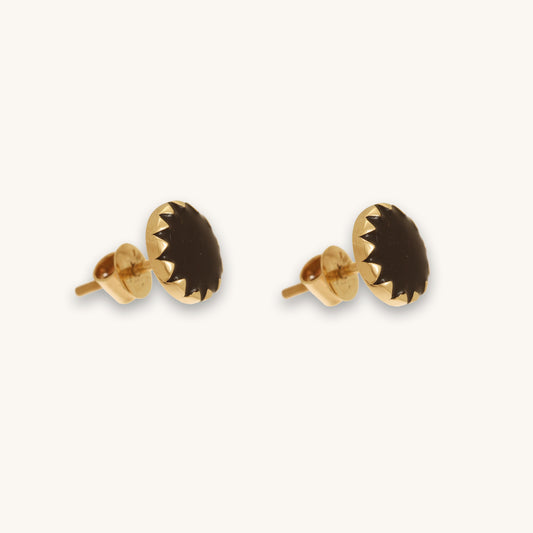 Caratly 18kt gold Round Gold Earring featuring a dark, flat circular center with a jagged, sunburst-style gold bezel setting under rs. 30,000