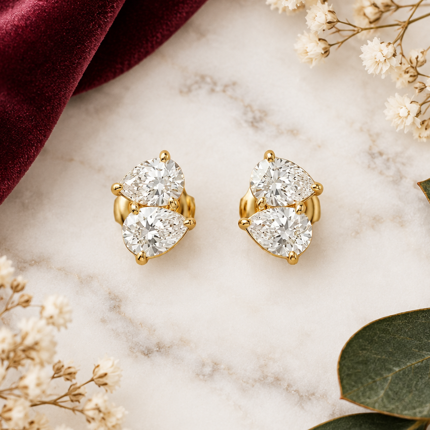  Gold stud earrings with two large clustered round diamonds. Priced under Rs. 40,000