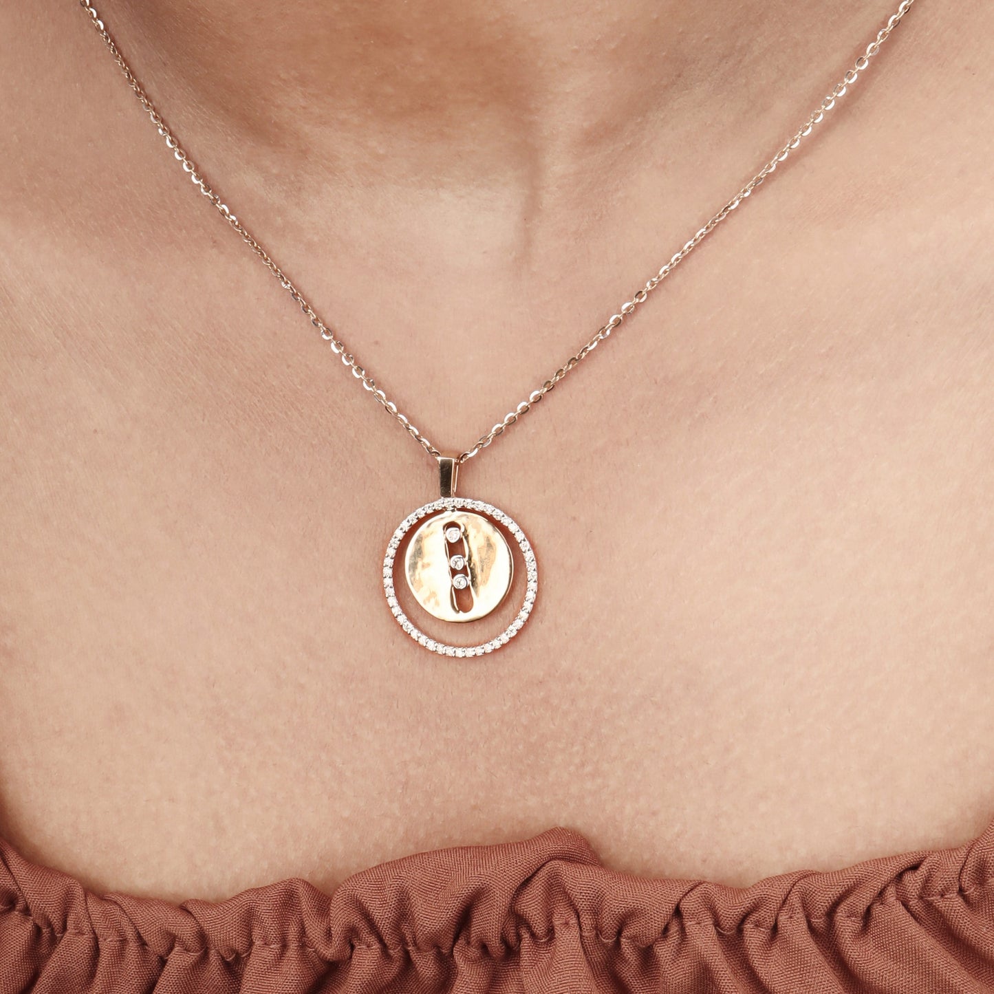 Caratly 18kt gold Double Circle Pendant featuring an outer circle of pave diamonds and a solid gold inner circle with a vertical row of three diamonds under Rs. 80,000