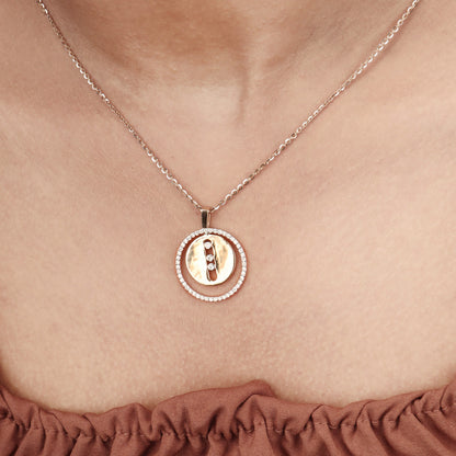 Caratly 18kt gold Double Circle Pendant featuring an outer circle of pave diamonds and a solid gold inner circle with a vertical row of three diamonds under Rs. 80,000