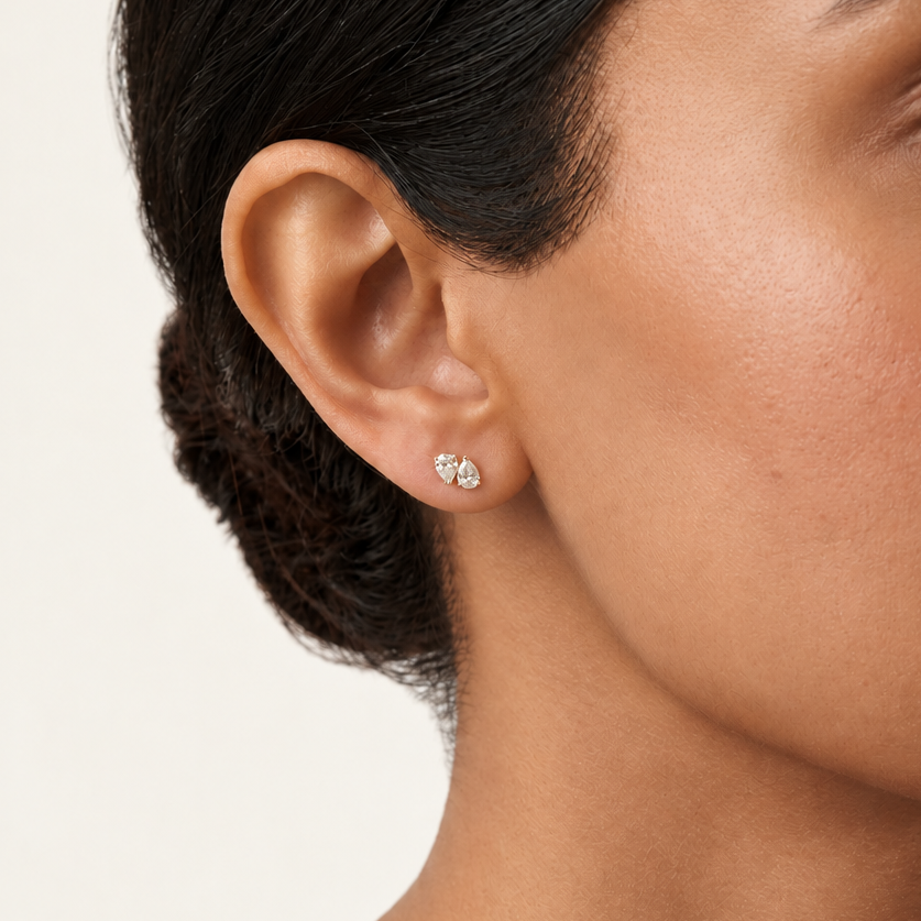  Gold stud earrings with two large clustered round diamonds. Priced under Rs. 40,000