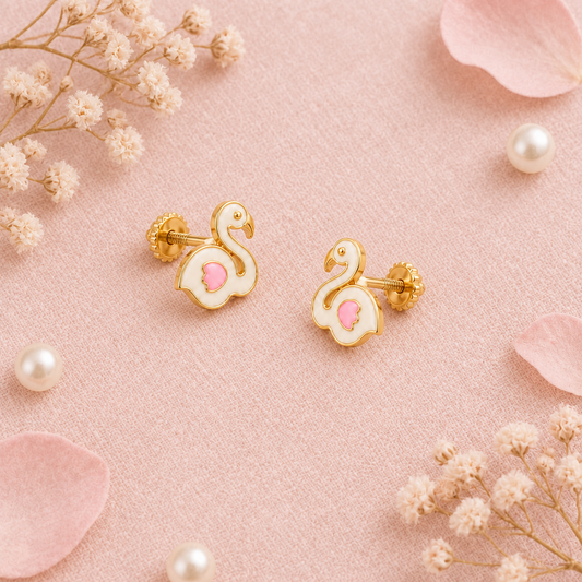 Gold stud earrings shaped like white enamel swans with pink wing detailing. Cute gifts for kids under Rs. 20,000