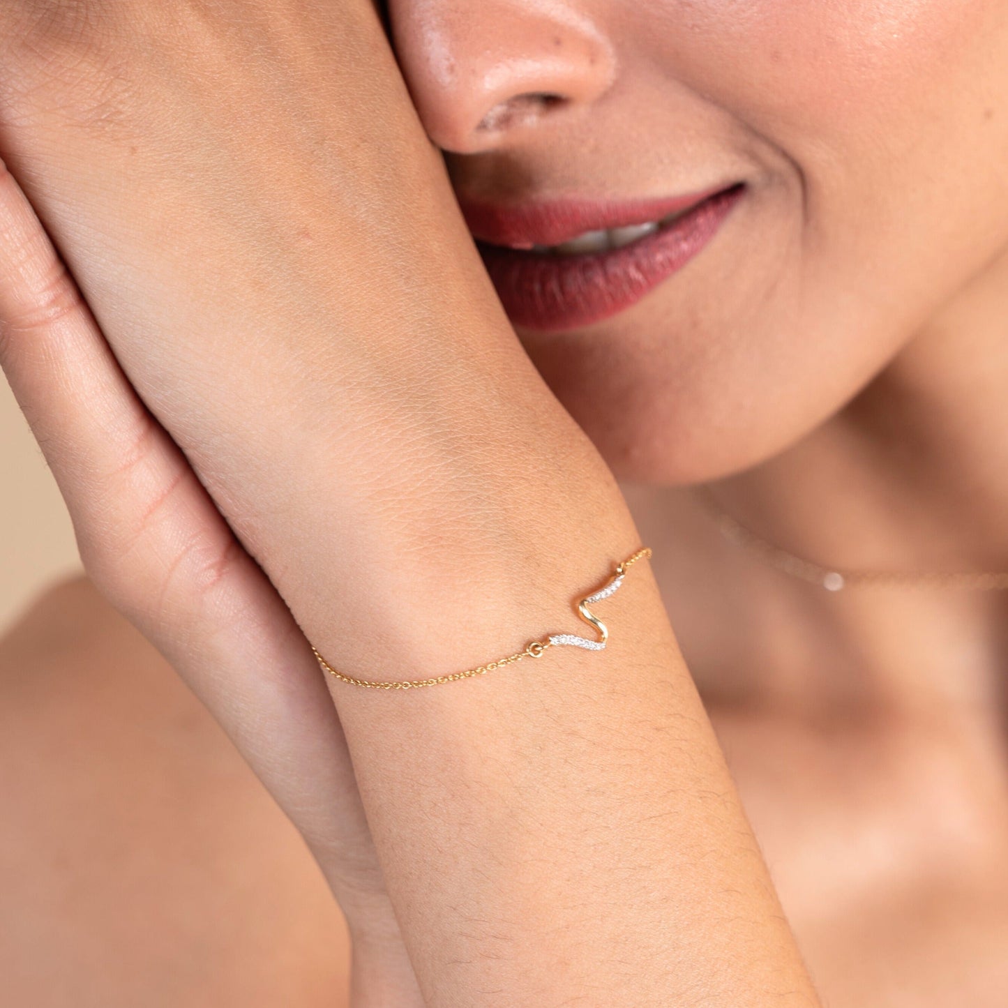 Caratly 18kt gold Swirl Diamond Bracelet featuring a smooth, fluid S-curve wave motif partially set with pave diamonds. Everyday minimal designs for her under Rs. 25,000