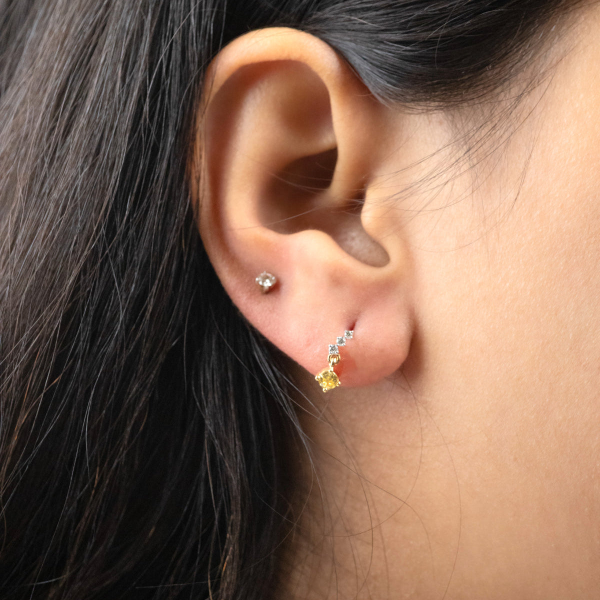 Caratly 18kt gold Drop Diamond Earring with 0.07ct diamond pave curve ending in a square yellow drop stud design under Rs. 30,000