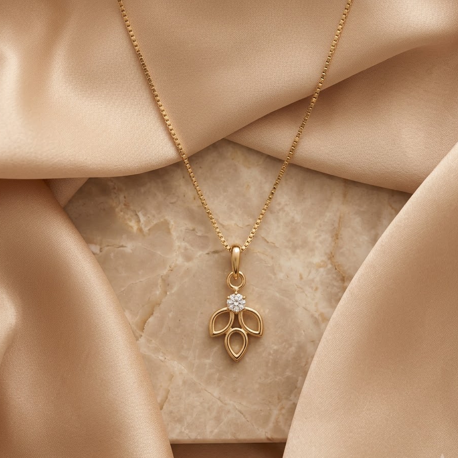 Gold open leaf-cluster pendant set with a sparkling diamond centre, priced under Rs. 20,000