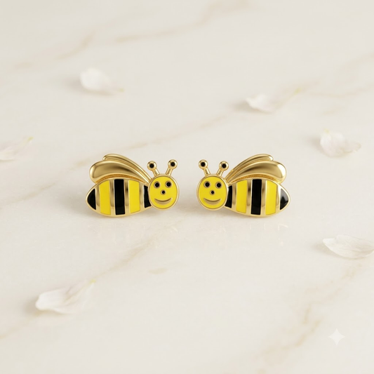 Gold stud earrings shaped like bees with yellow and black enamel stripes. Cute and minimal gold gifts for kids under Rs. 30,000