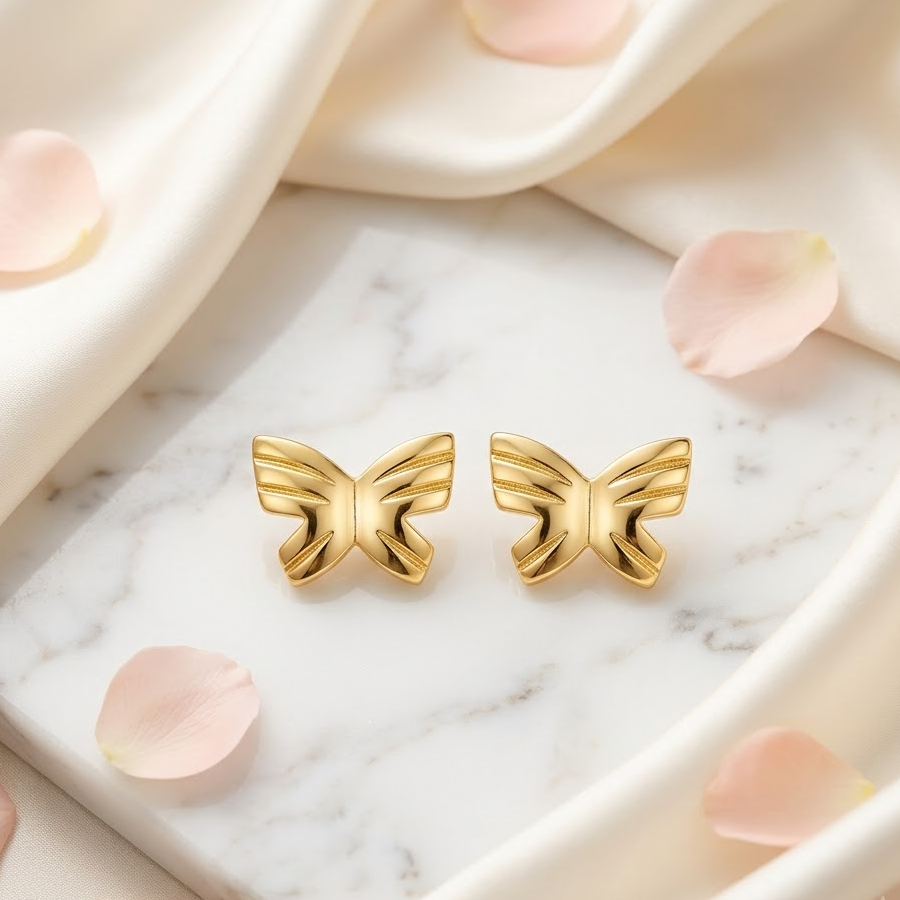 Pair of polished solid gold butterfly stud earrings. Cute gold gifts for kids under Rs, 25,000