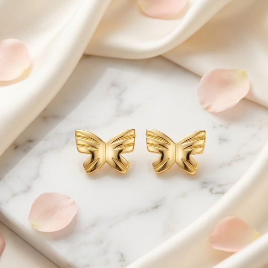 Pair of polished solid gold butterfly stud earrings. Cute gold gifts for kids under Rs, 25,000