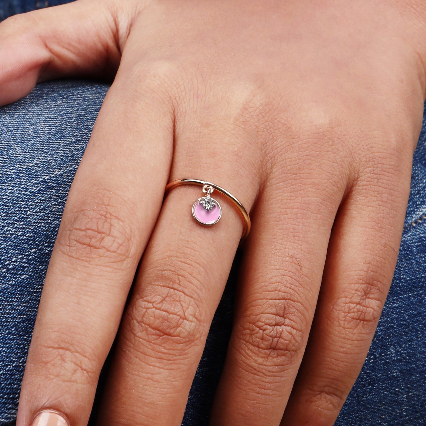 Caratly 18kt gold Pink Dangling Ring featuring a thin gold band and a swinging round pink enamel charm accented with a single diamond under Rs 25,000