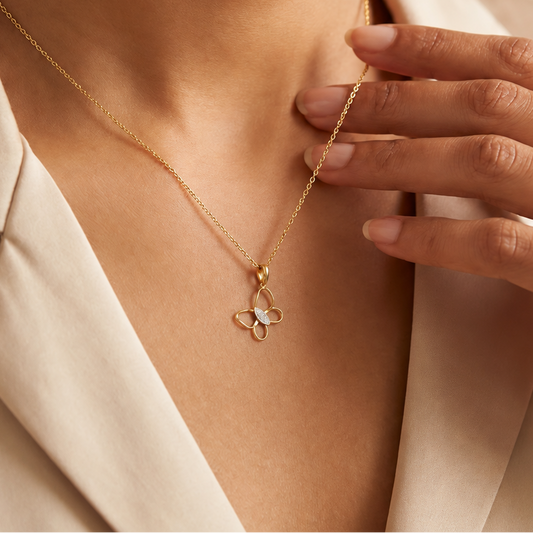 Gold open butterfly pendant with wings outlined in gold and a diamond-set body priced at Rs. 15,000