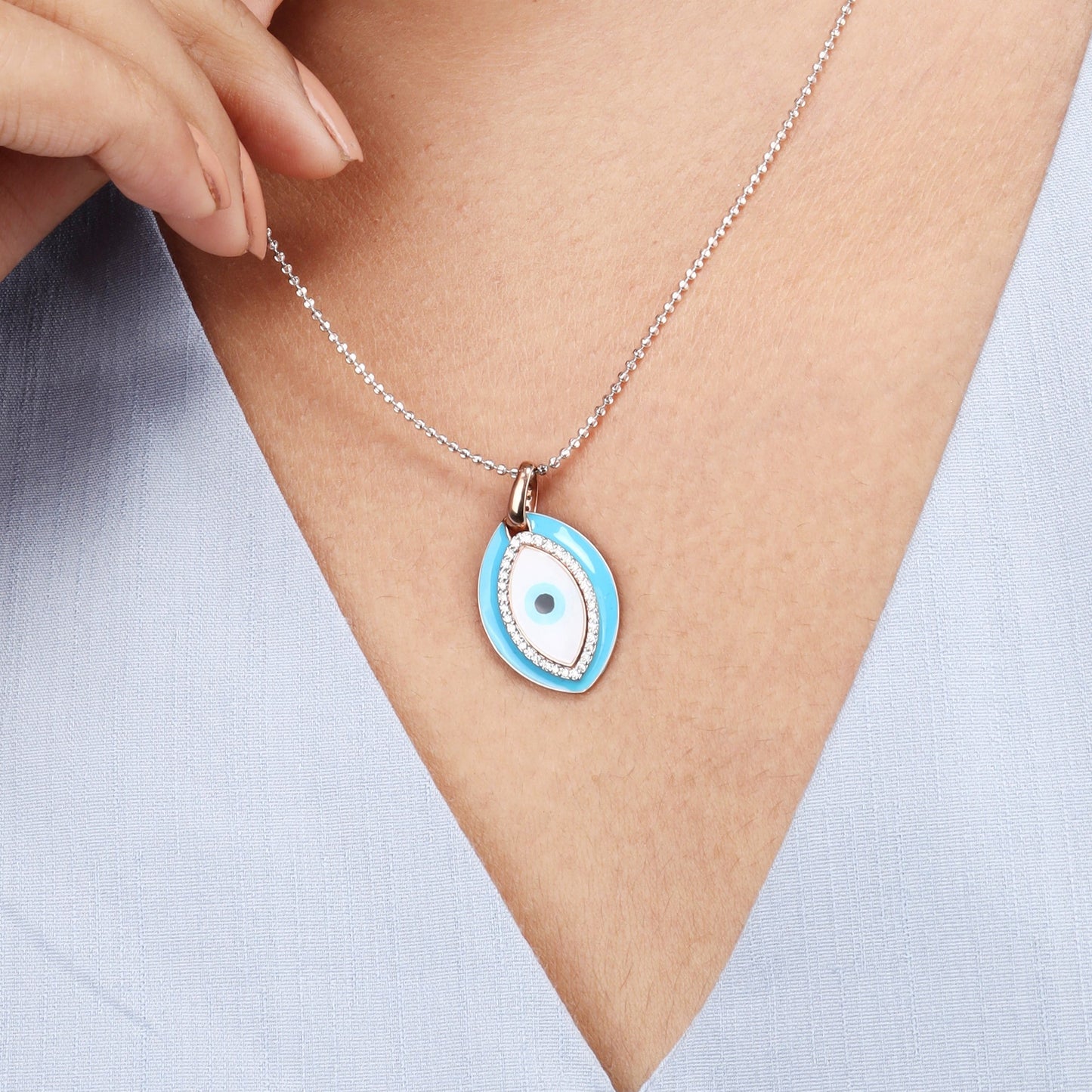 Caratly 18kt gold Evil Eye Pendant featuring a large turquoise enamel oval charm bordered and centered with pave diamonds under Rs. 40,000