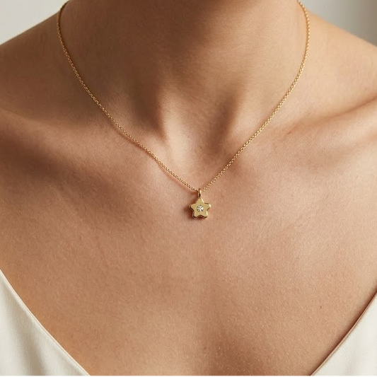 Gold star-shaped flower pendant set with a single sparkling diamond, priced under Rs. 25,000