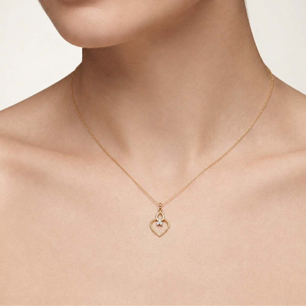 Gold textured heart-shaped pendant with a teardrop top and a diamond cluster accent priced under Rs. 20,000