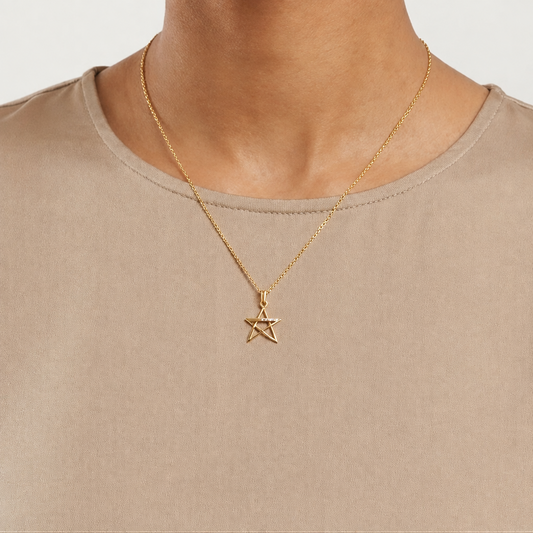 Gold asymmetric star pendant with a sparkling diamond-set band priced under Rs. 15,000