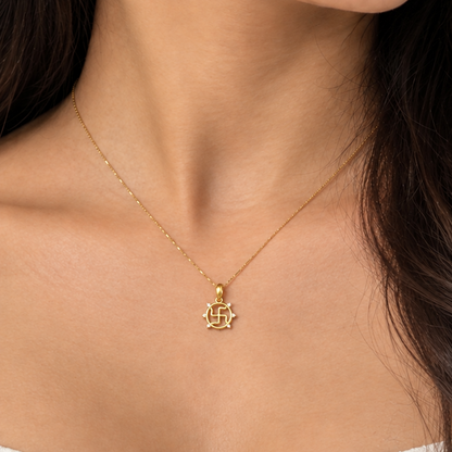 Gold swastik pendant in a circular frame set with sparkling diamond accents, minimal gifts starts at Rs. 15,000