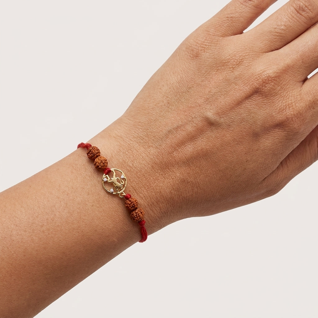 Gold Hanuman Ji Rakhi with sacred Rudraksha beads.