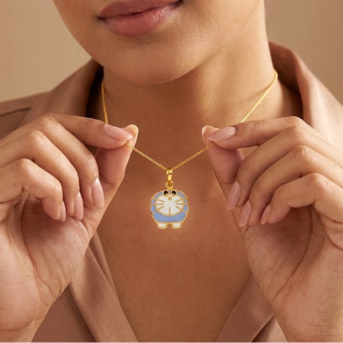 Gold Doraemon character pendant with blue and white enamel detailing.
