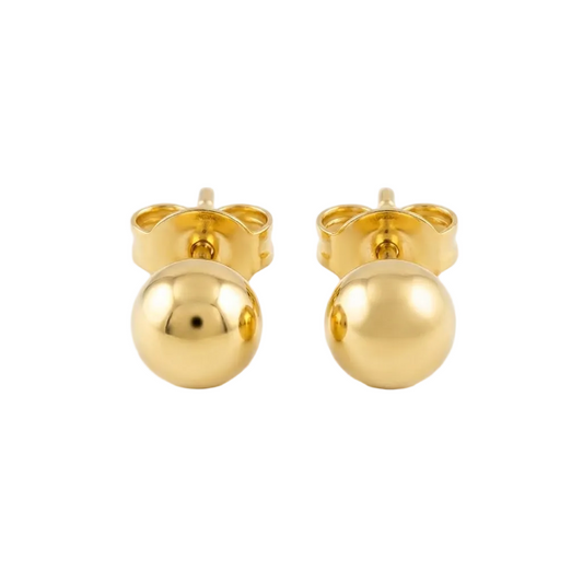 Pair of polished 18kt gold ball stud earrings on a soft neutral surface. Perfect for second piercings, Kids under Rs. 15,000