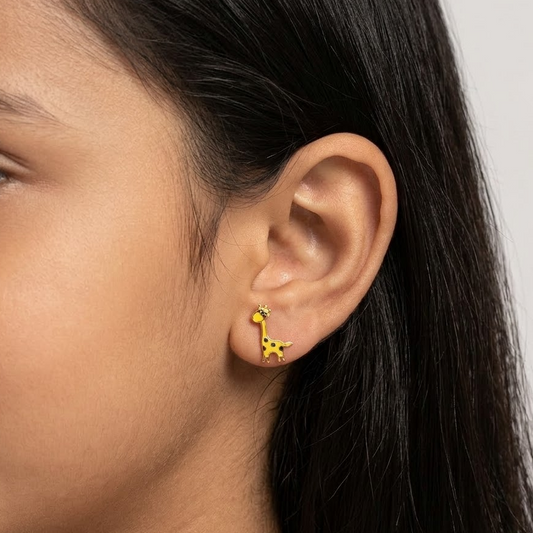 Gold stud earrings shaped like giraffes with yellow and brown enamel spots. Cute gold gifts for kids under Rs. 20,000