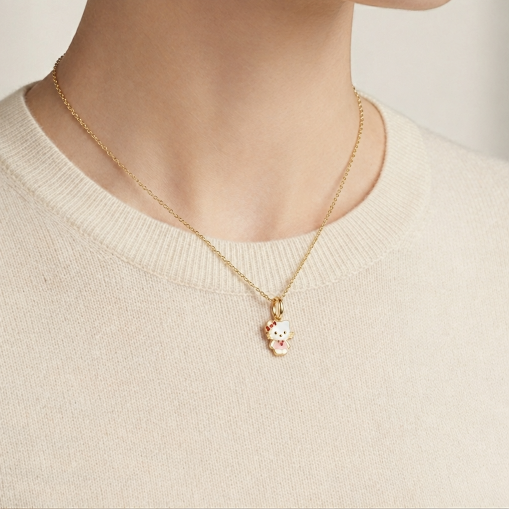 Hello Kitty pendant with white enamel body and a red bow accent priced under Rs. 15,000
