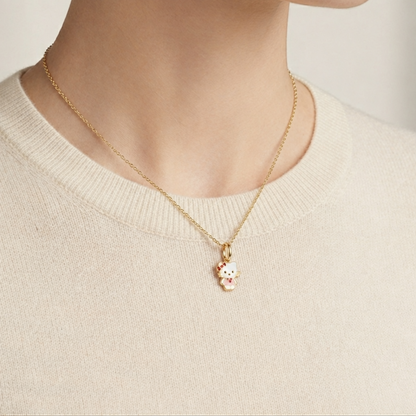 Hello Kitty pendant with white enamel body and a red bow accent priced under Rs. 15,000