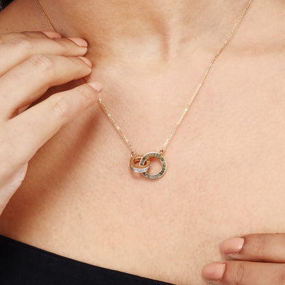 Caratly 18kt gold Interlocked Diamond Necklace featuring two connected circle pendants, one in plain textured gold and one set with 0.15ct pave diamonds, attached to a gold chain