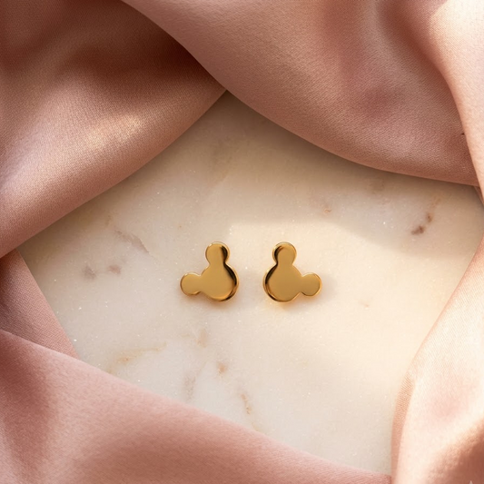 Polished gold stud earrings in the silhouette of a mouse-ear character face. Cute gold gifts for kids under Rs. 15,000