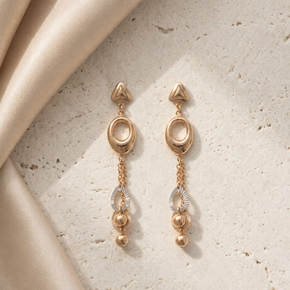 Gold dangle earrings with an oval link and layered beaded drops below. A luxe gift for her under Rs. 70,000