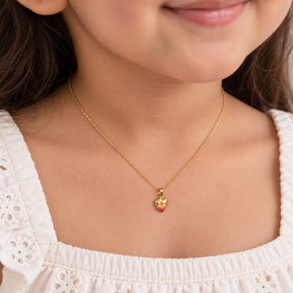 Gold puffed heart pendant with a pink enamel gradient at the base
