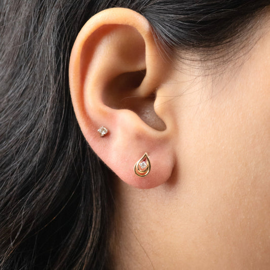 Caratly 18kt gold Droplet Diamond Earring with 0.04ct diamond accent in a stylized teardrop paisley stud design under Rs. 30,000