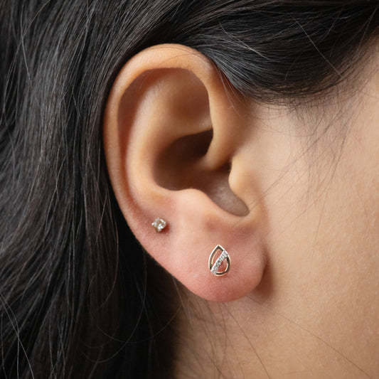 Caratly 18kt gold Pear Diamond Earring with 0.04ct diamond accent in an openwork teardrop stud design under Rs. 20,000