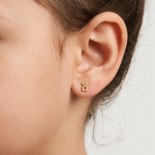 Gold teddy bear stud earrings with a heart-shaped cutout in the center under Rs. 20,000